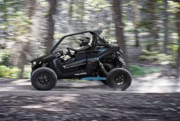 Polaris RZR RS1 driving fast in the forrest