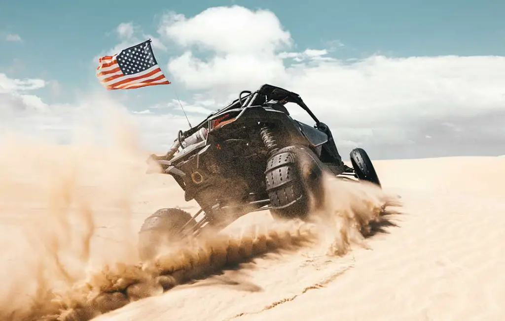 UTV with paddle tires for driving in sand