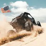 UTV with paddle sand tires and USA flag